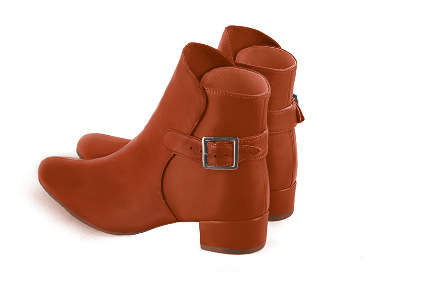 Terracotta orange women's ankle boots with buckles at the back. Round toe. Low block heels. Rear view - Florence KOOIJMAN
